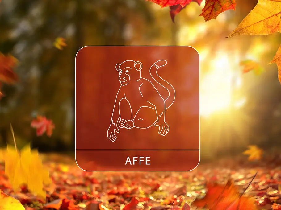 Das Sternzeichen Affe umgeben von buntem Herbstlaub im Wald