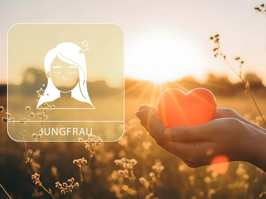 Sternzeichen Jungfrau neben einer Hand, die ein rotes Herz vor einem Feld im Sommer hält