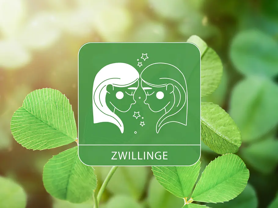 Das Sternzeichen Zwillinge vor leuchtenden Kleeblättern