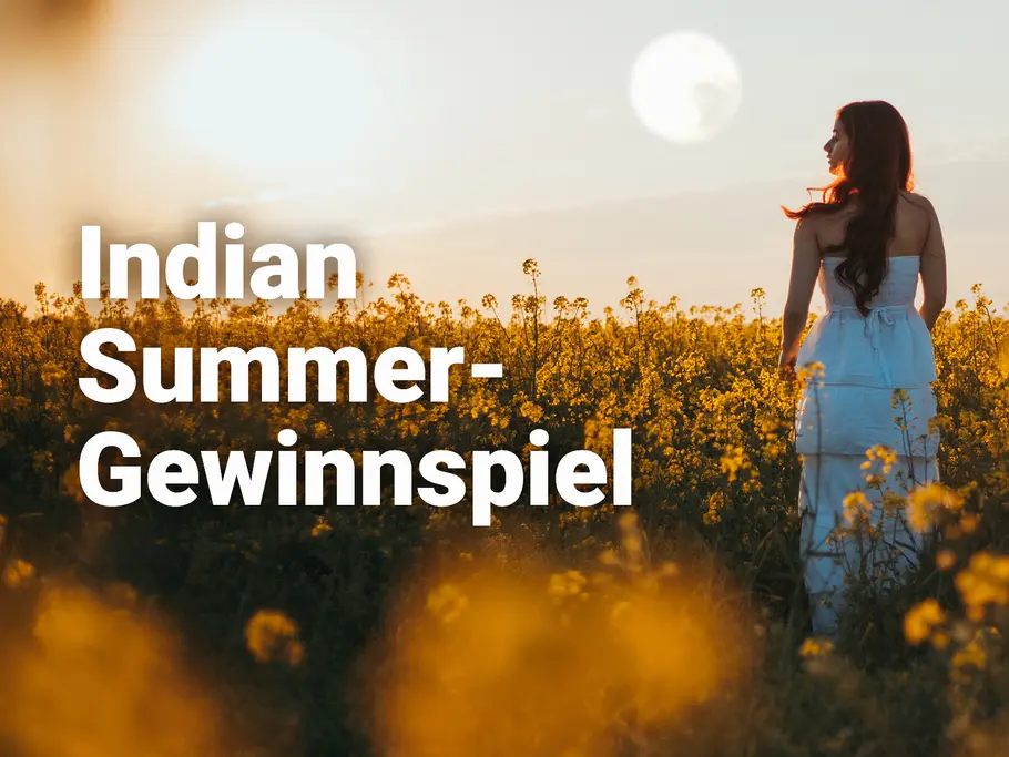 Indian Summer-Gewinnspiel Frau in einem Feld mit gelben Blumen als Titelbild für das Indian Summer Gewinnspiel von Astrowoche