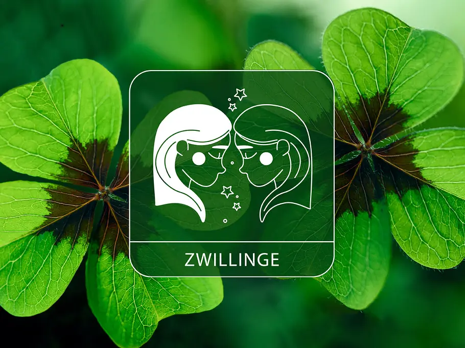 Sternzeichen Zwillinge vor grünem Glücksklee