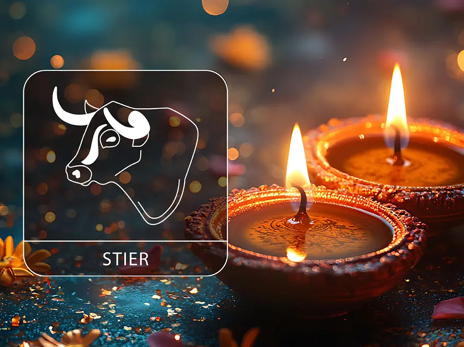 Sternzeichen Stier neben zwei brennende Kerzen.