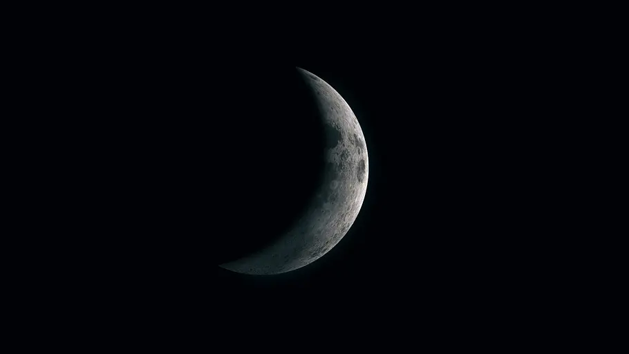 Neumond im Dezember 2023: Aufbruch zu neuen Abenteuern und erweitertem Optimismus Der Halbmond im dunklen Nacht-Himmel.